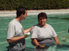 Ara being baptized