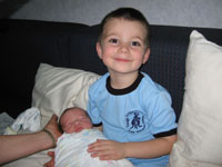 Drew likes holding his little brother