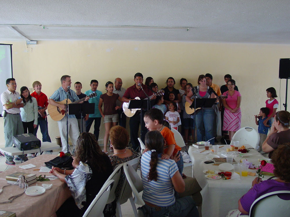 Children singing to mothers